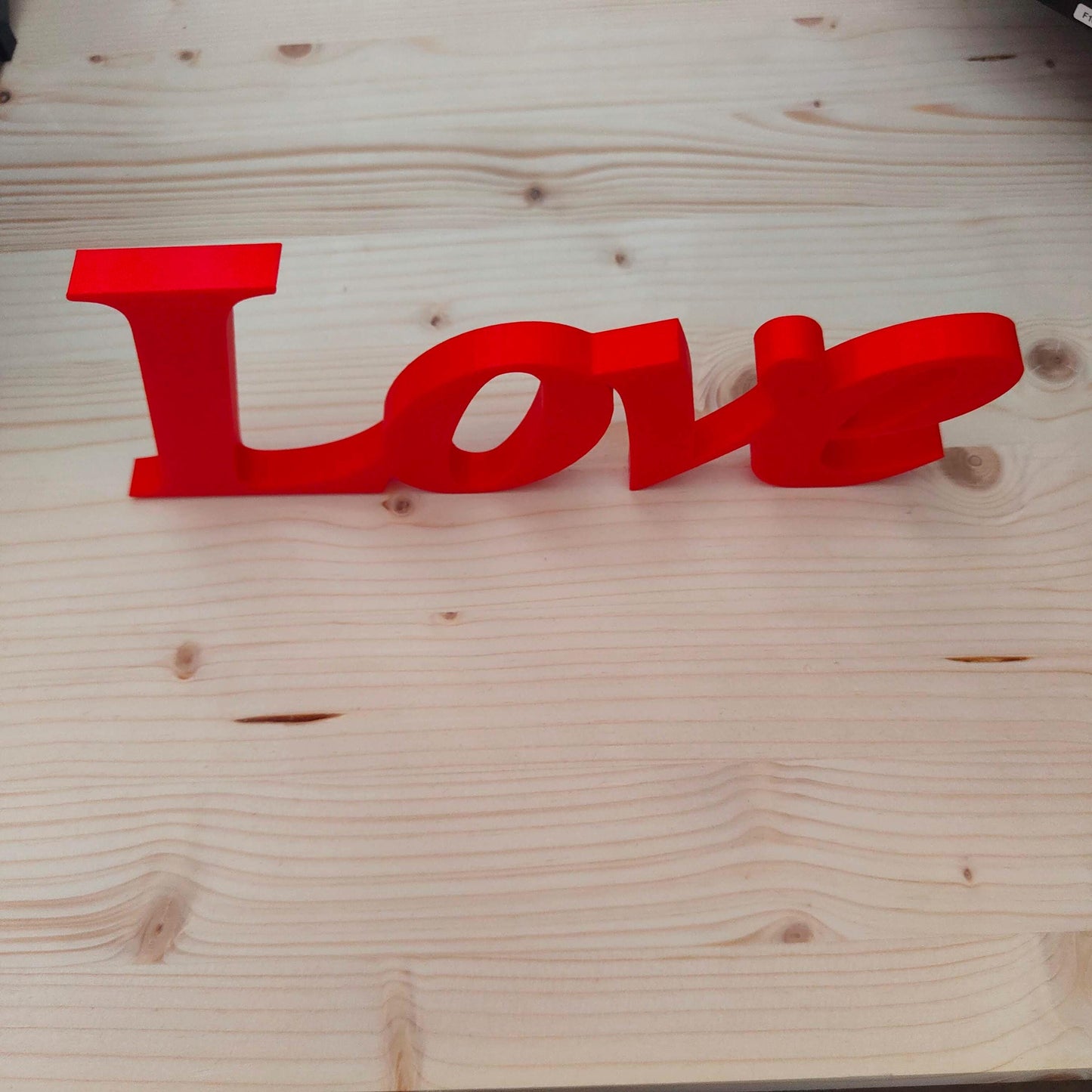 Love word sign, abstract modern design, red, 3D printed, elegant tabledecoration living room, home decor