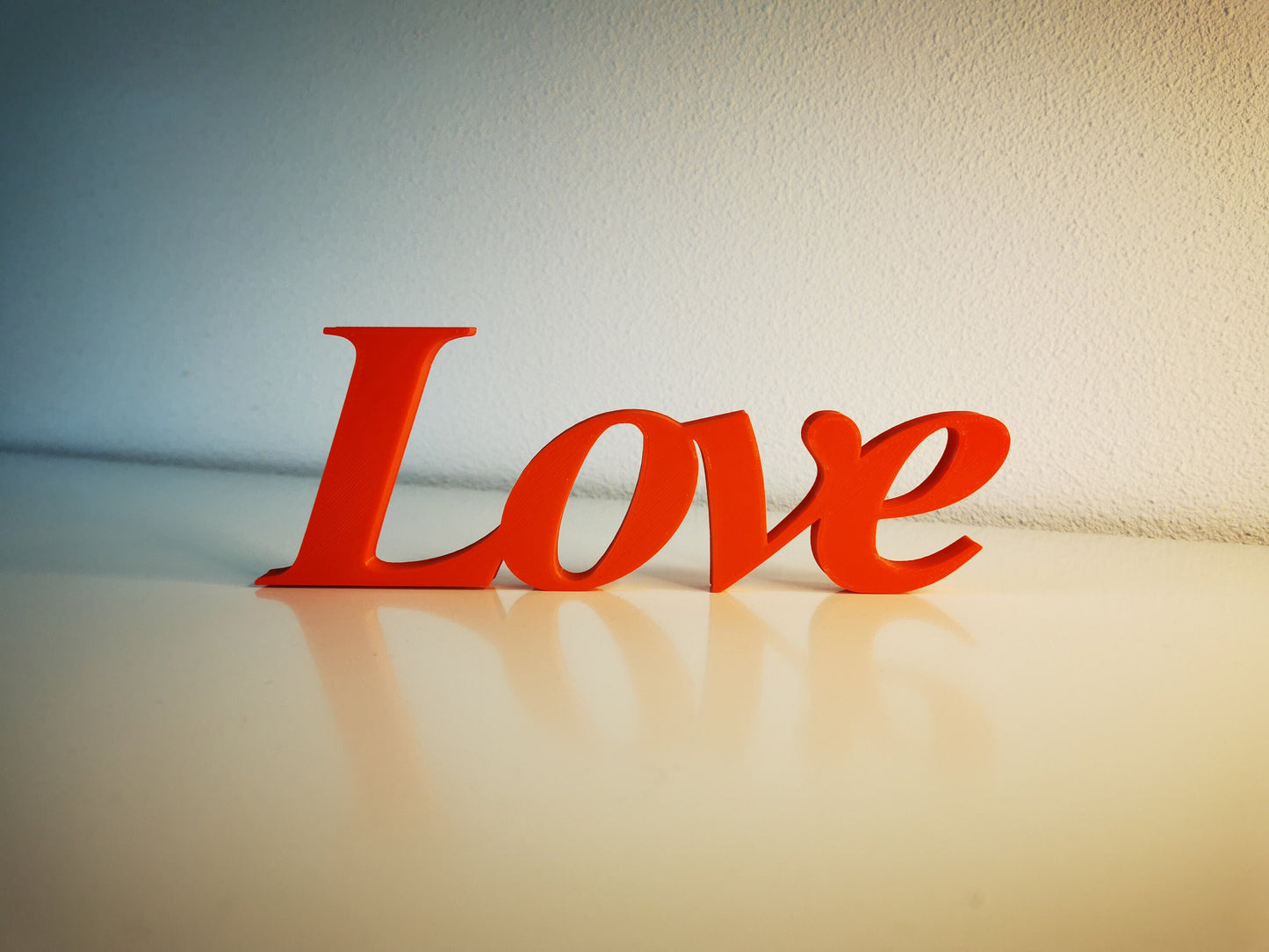 Love word sign, abstract modern design, red, 3D printed, elegant tabledecoration living room, home decor