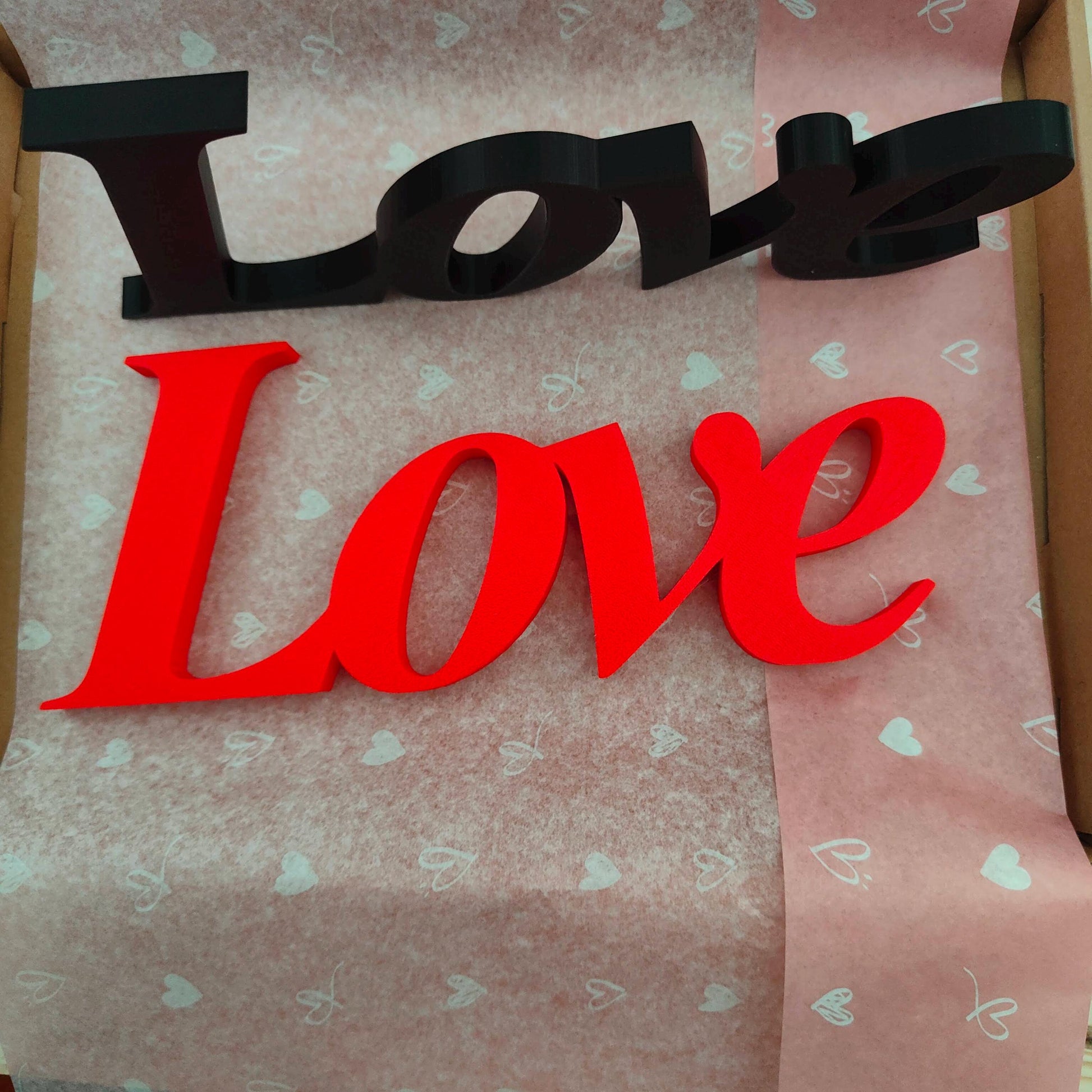 Love word sign, abstract modern design, red, 3D printed, elegant tabledecoration living room, home decor