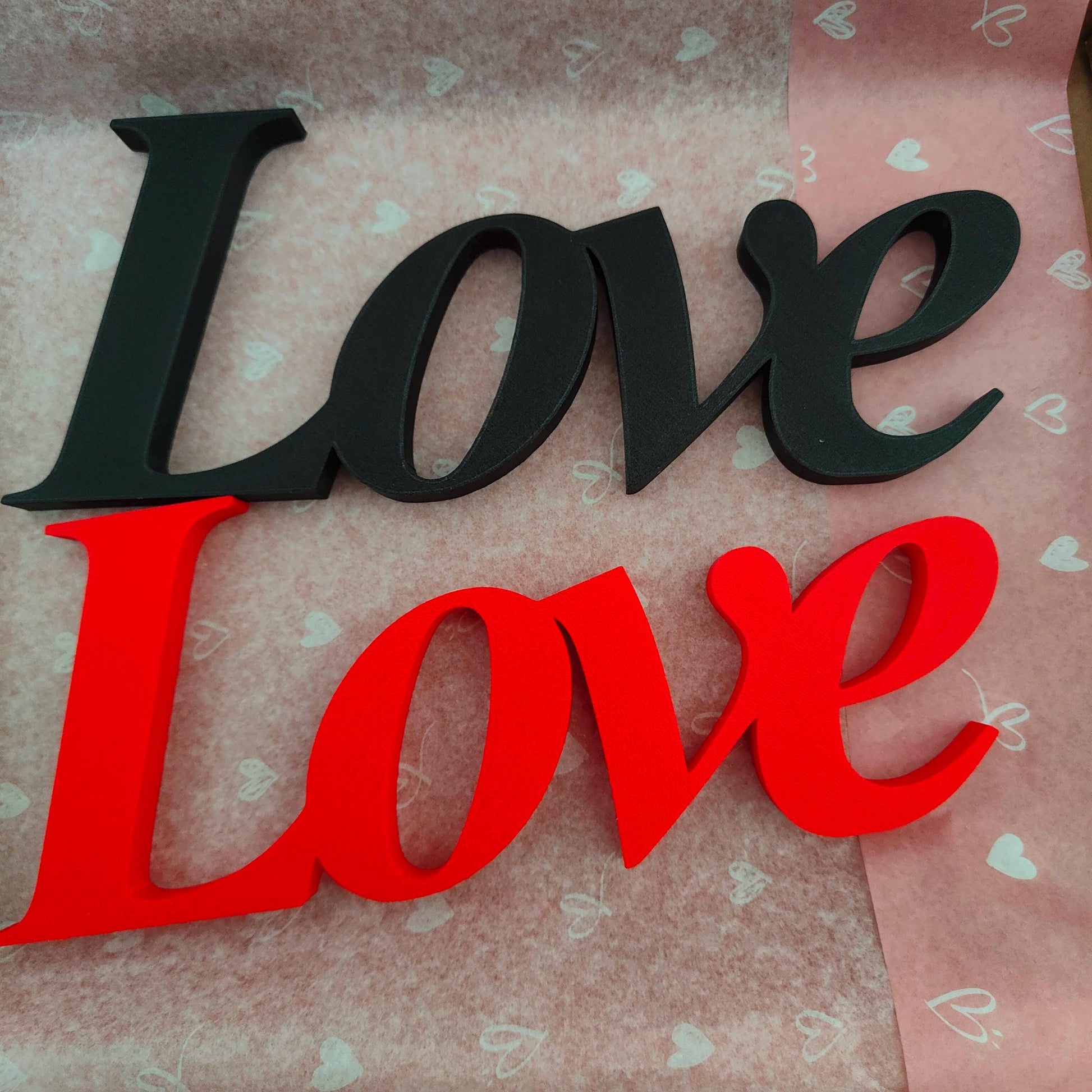 Love word sign, abstract modern design, red, 3D printed, elegant tabledecoration living room, home decor