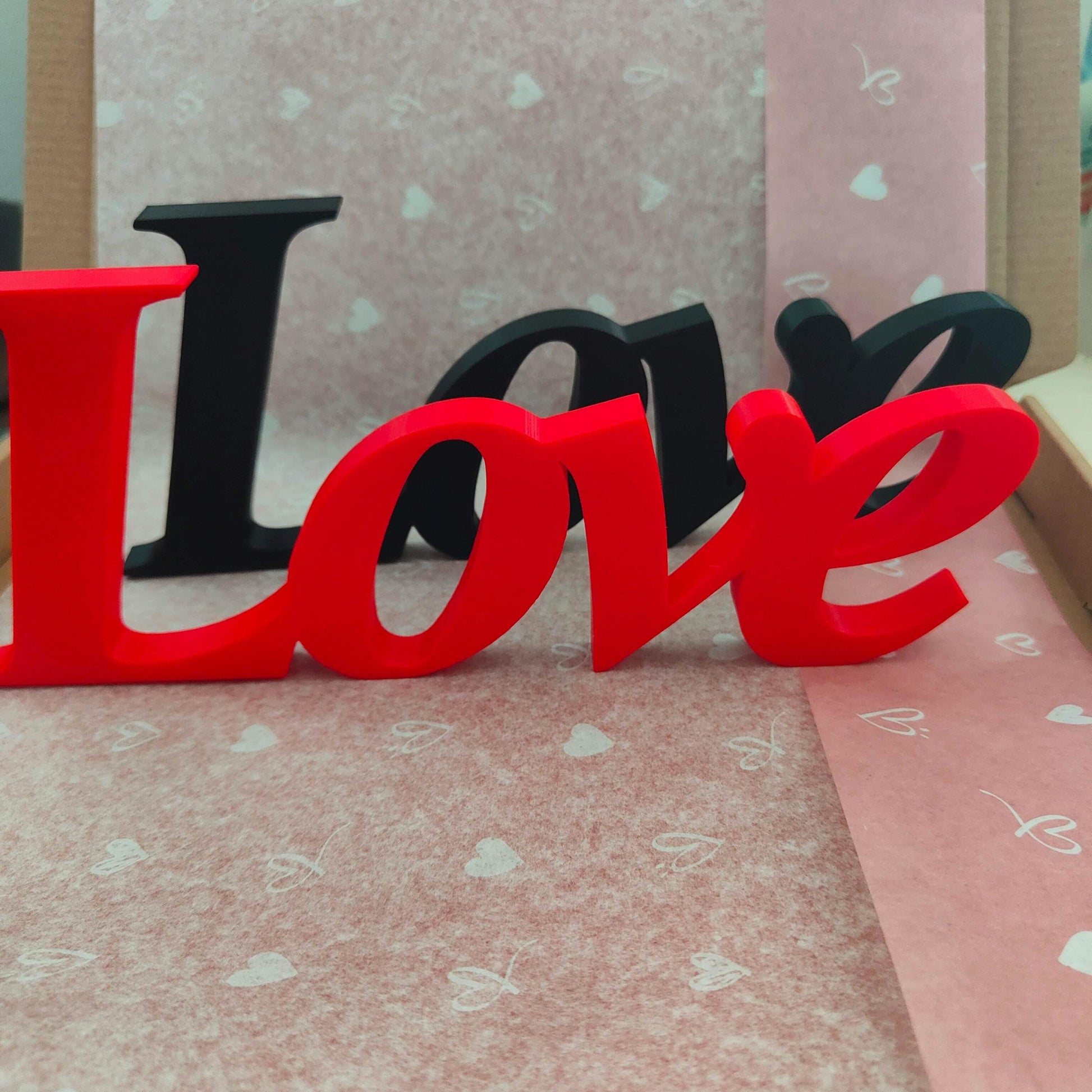 Love word sign, abstract modern design, red, 3D printed, elegant tabledecoration living room, home decor