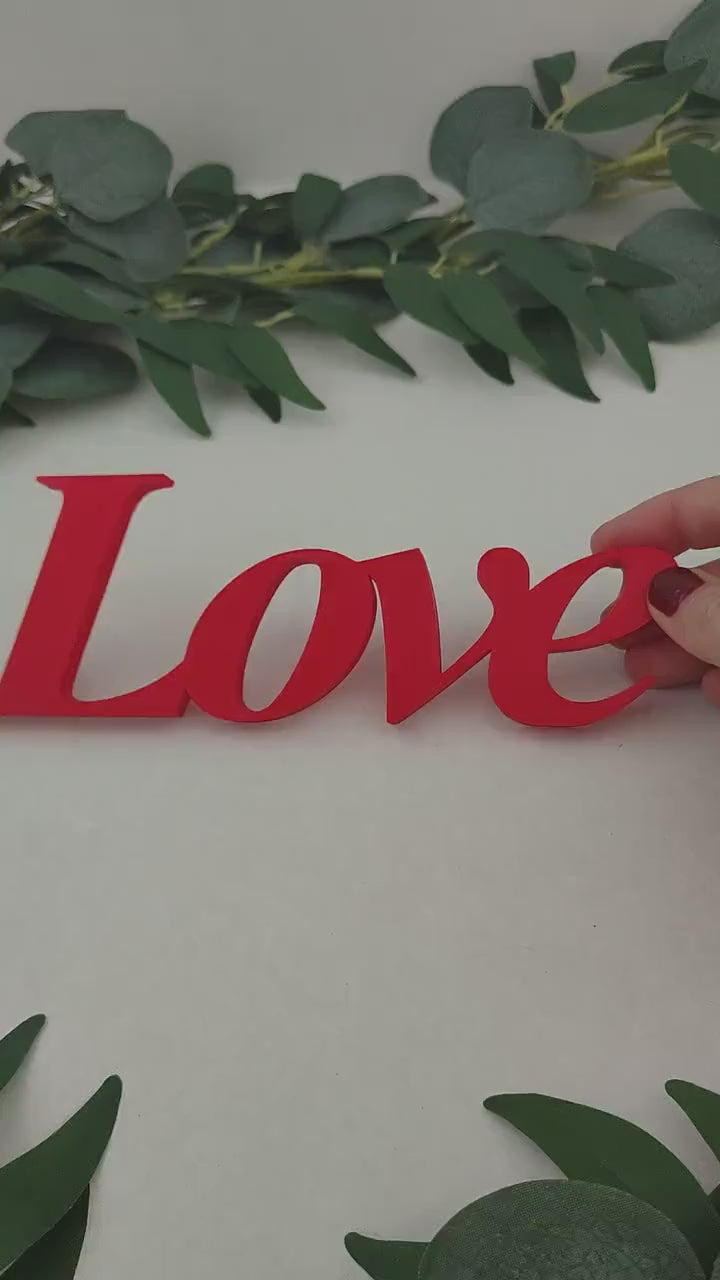 Love word sign, abstract modern design, red, 3D printed, elegant tabledecoration living room, home decor